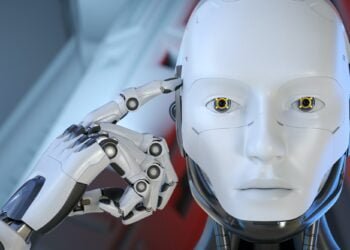 The robot put his finger to the head